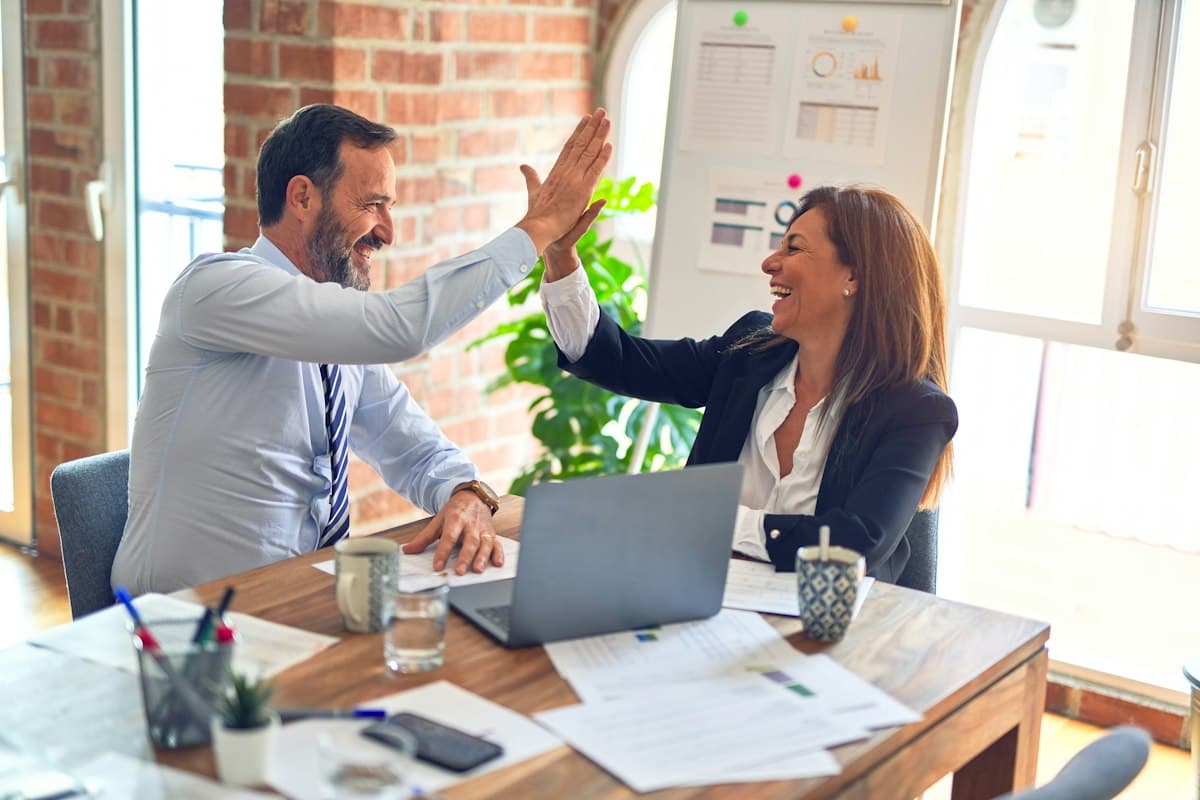 Two people shaking hands in agreement